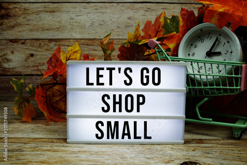 Schilderij op canvas Let's Go Shop Small text with trolley shopping cart and alarm clock decoration w