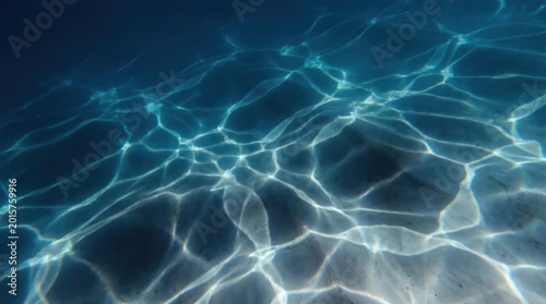 Underwater sun rays and light caustics on sea floor, shimmering blue water surface background, aquatic ocean ripples with sunbeams, deep turquoise marine environment for summer advertising.