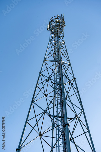 Low angle view of telecommunication tower against clear blue sky railway station Vrbatky, Czech Republic - May 3, 2026 Zeleznicni stanice, vlakova zastavka Nadrazi