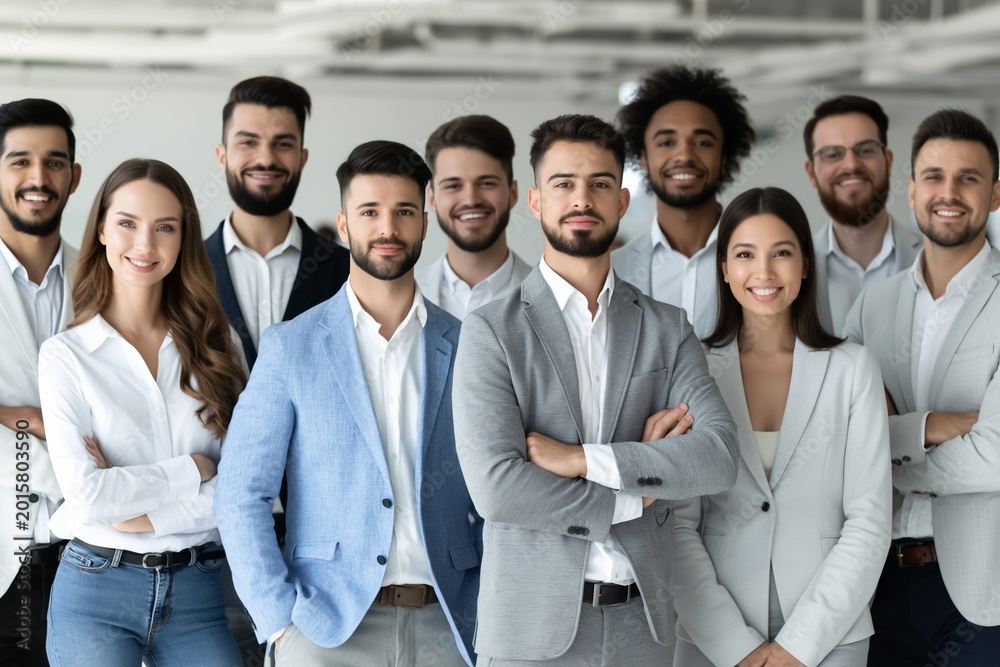 Fototapeta premium Confident corporate team posing in modern office