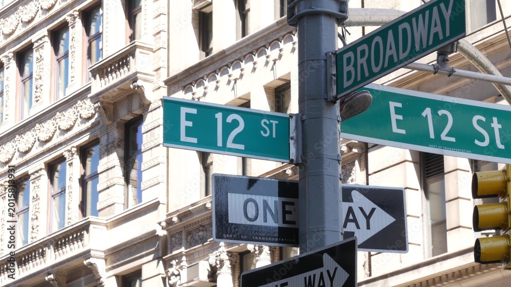 Obraz premium New York City Broadway street sign on Manhattan, United States. Urban road sign in american city. Traffic sign in Midtown of NYC, USA. Building architecture in residential district near Union Square.