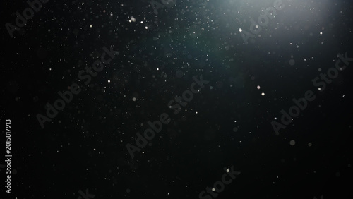 Photos Slow motion real dust particles floating mid air over dark background