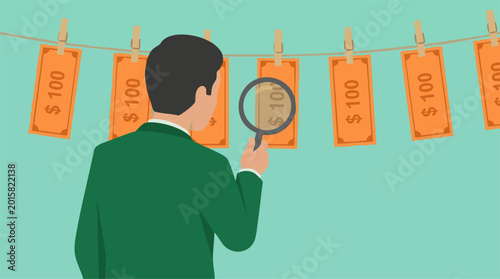 Tableau sur toile Businessman examining cash on a clothesline with magnifying glass, money launder