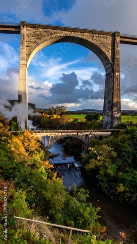 stone arch bridge over river landscape.