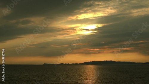 Isolated Island at Sunset Over a Melancholic Evening Sea