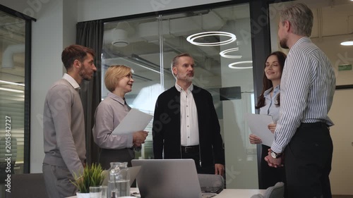 Business people shaking hands, finishing up a meeting