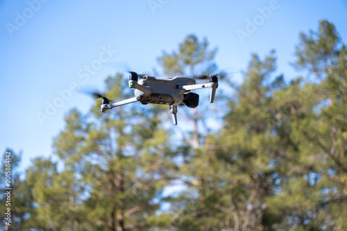 Quadro su tela drone flying against a blue summer sky.