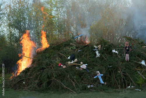 Tableau sur toile Ignition of large bonfire with witches effigies during spring festival near Libe