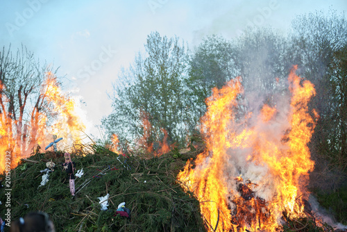 Fotografie Ignition of large bonfire with witches effigies during spring festival near Libe