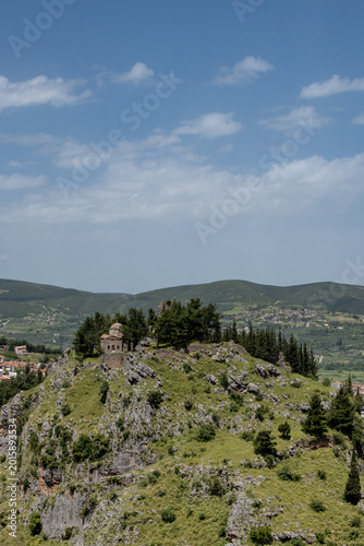 View at the castle of Livadia from the top of the mountain  at Boeotia-Greece. Blue sly with clouds at the background.