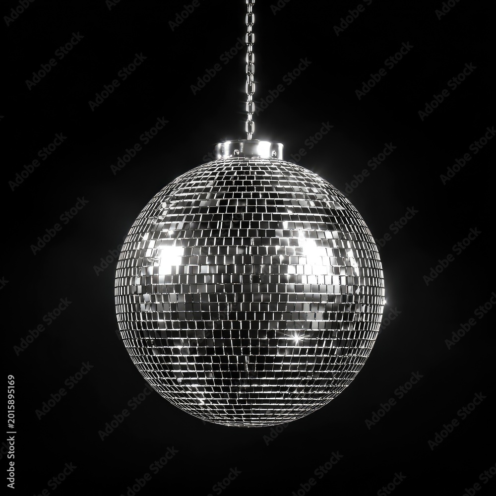Fototapeta premium Gleaming mirrored orb suspended by a chain against a dark backdrop