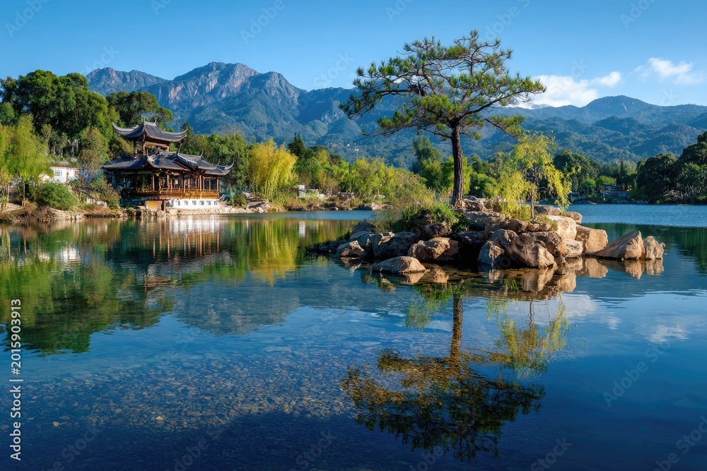 Obraz premium Lakeside pagoda and tree reflection