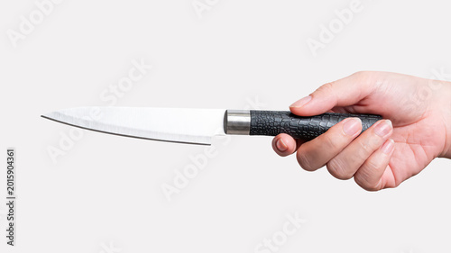 Female hand holding a steel cooking knife isolated on white background with a clipping path.