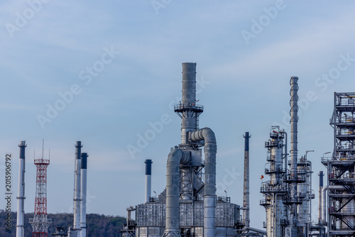 Aerial view of a massive oil refinery plant with intricate pipe systems.