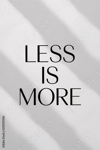 Typography featuring a minimalist life philosophy sits under soft morning light.