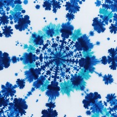 Blue and cyan tie dye fabric pattern. Concentric radial abstract design created with dye on white cloth. Circular snowflake like shapes spread outward.
