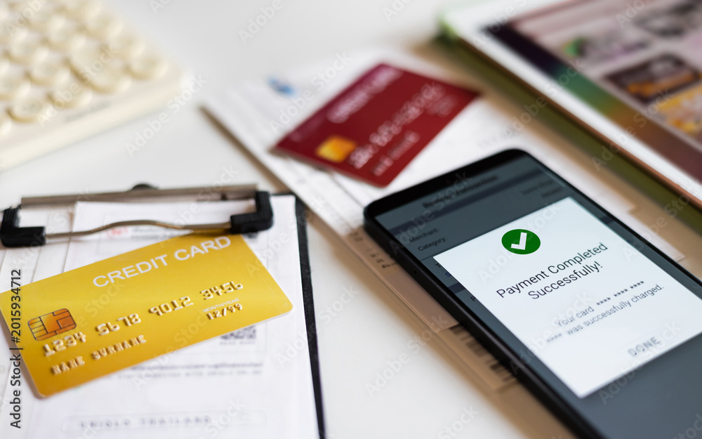 Fototapeta premium close-up shot, online banking concept using mobile app in phone to pay expenses from credit card