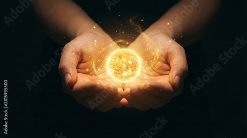 Hands Holding Glowing Miniature Sun Energy Ball