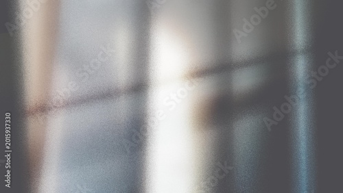 Abstract, blurred, grey, glass, texture, neutral metallic frosted surface background with film grain and soft window light