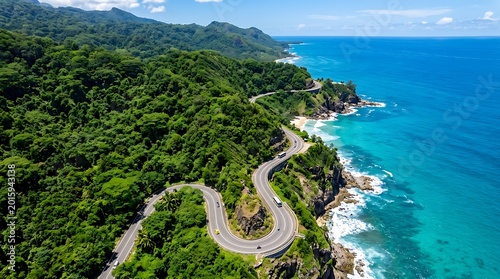 Winding coastal highway beside ocean, cliffs, and forest