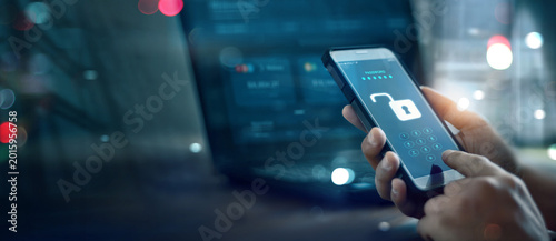 Bild auf Leinwand A male scammer used a mobile phone to unlock the security code of victims' bank accounts