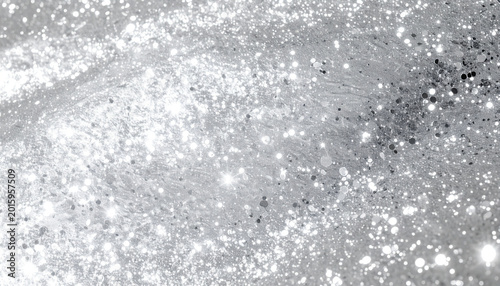 Brilliant platinum metallic texture with glowing sparkles and light bokeh