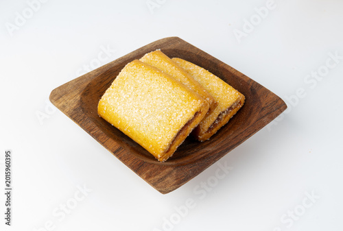 Fig roll bar, square sugar cookies with fruit filling isolated. Taiwanese pineapple cake, brown rectangular strudel biscuits, sweet apple roll pastry on white background