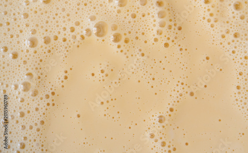 Orange milkshake texture closeup
