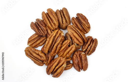 Pile of pecan nuts kernels isolated on white background. no shell unpeeled