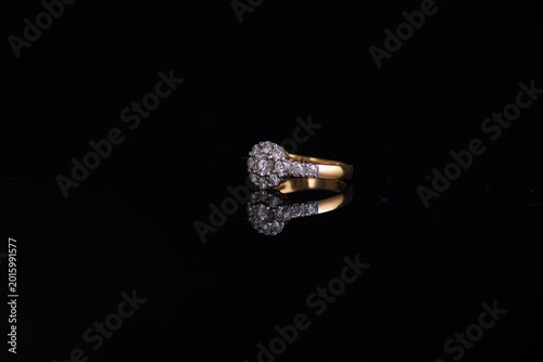 Diamond ring on the black background.