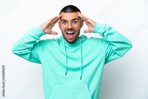 Canvas Print Young caucasian man isolated on white background with surprise expression
