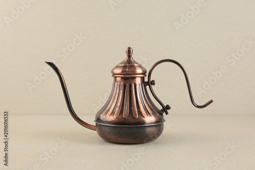 Bild auf Leinwand a rustic copper gooseneck, isolated on a minimalist natural beige base, with stu