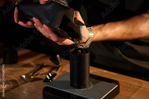 Tableau sur toile Clever Dripper coffee brewing with barista pouring water from gooseneck kettle