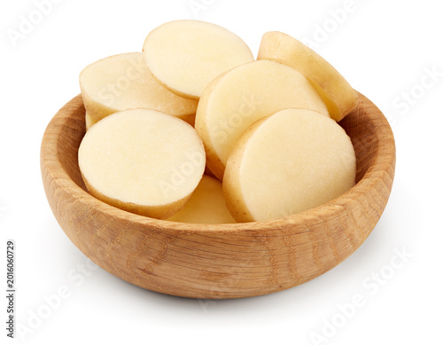 sliced raw potato in wooden bowl isolated on white background. clipping path