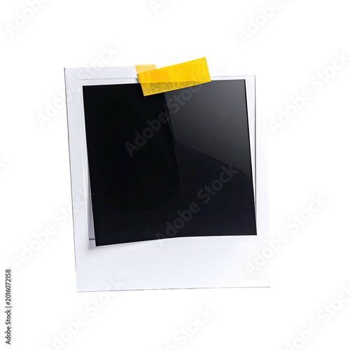 Blank instant photo with yellow tape on top corner