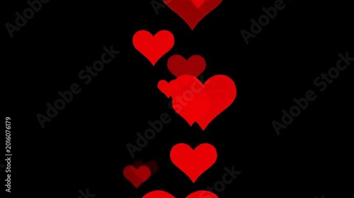 Floating red hearts against black background for romance or love concepts