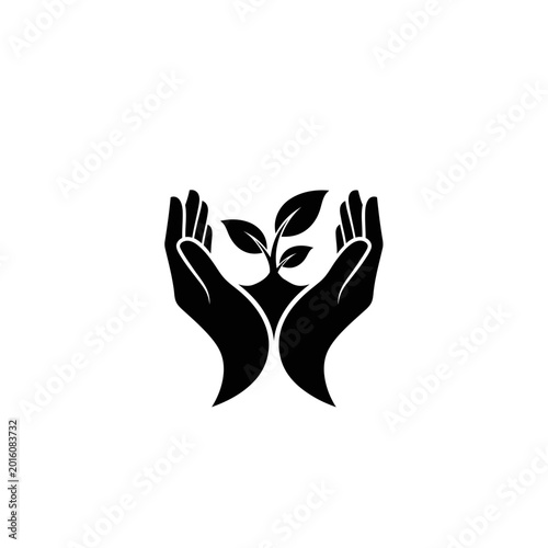 Black silhouette of hands protecting a small plant sprout