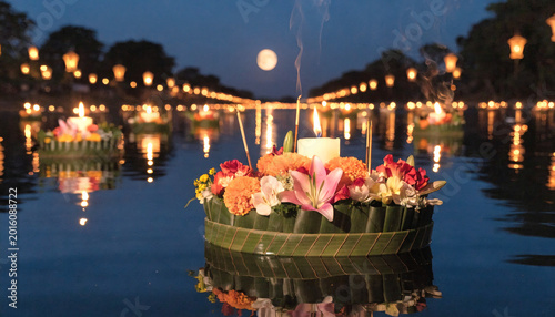 Magical Loy Krathong Festival Night with Floating Candle Lanterns on River