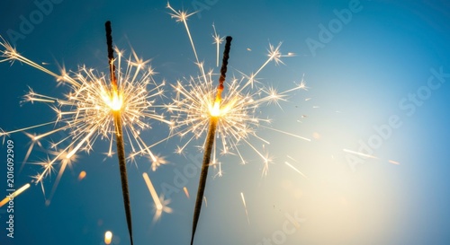 Sparklers burning in night sky.