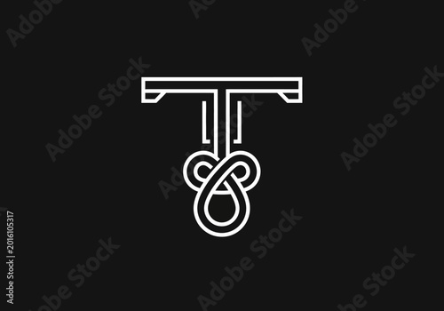 Foto Geometric white letter T logo with ornate knot design