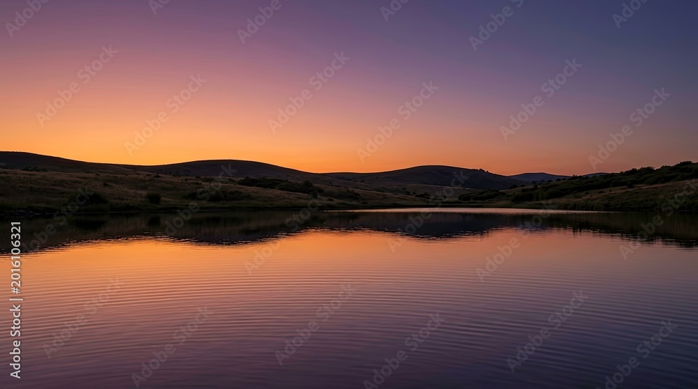 Obraz premium Serene Sunset Over Calm Lake In Countryside Landscape