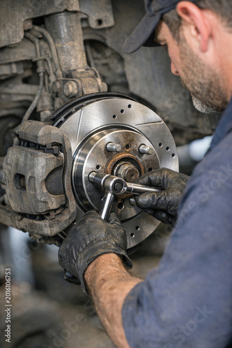 A technician focused on a piece of equipment