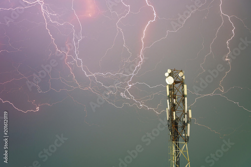 Lightning Strikes Near Communication Tower Under Dramatic Sky