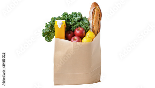 Foto Brown paper grocery bag filled with apples lemons kale juice and baguette, isola