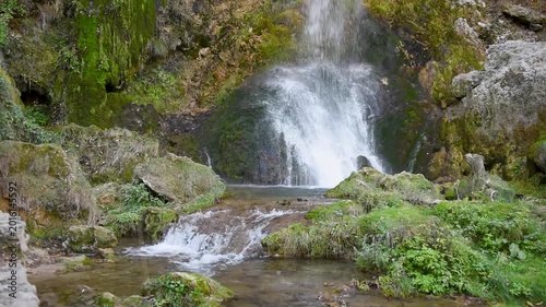 Gostilje waterfall in southern Serbia, water fall from high and splash on stone, travel destination