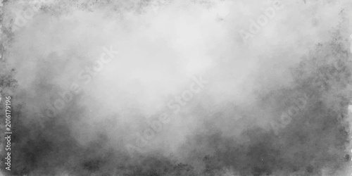 Abstract black and white grunge metal texture featuring a dark stormy sky with motion-blurred smoke and thick gray fog clouds