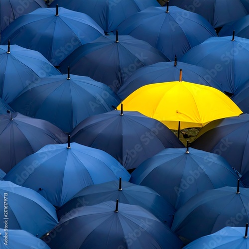 One bright umbrella stands out from the crowd