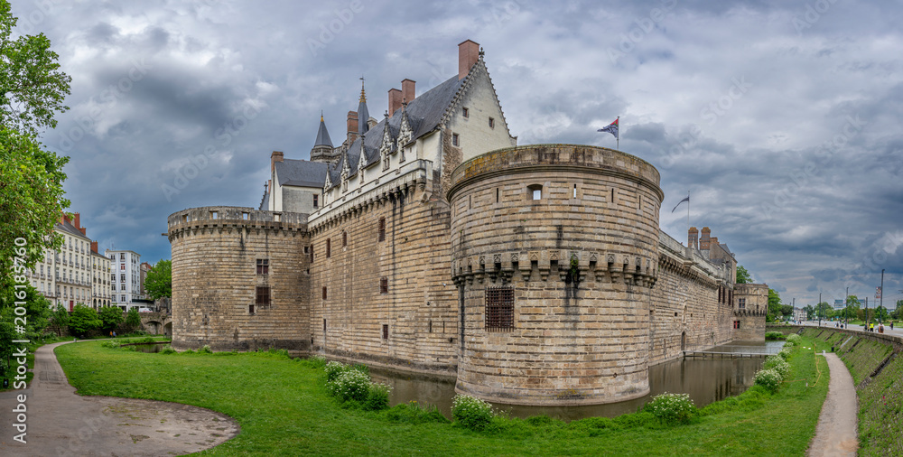 Fototapeta premium Nantes, France - 05 07 2026: Castle of the Dukes of Brittany. Panoramic view of the fortified castle with dungeons and moats