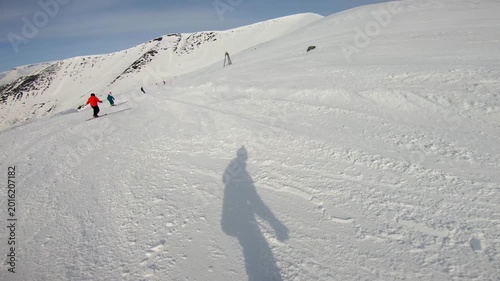 Group Actively Practicing Ski Techniques Amid Lively Resort Surroundings. Enthusiastic Individuals Refining Their Skiing Skills Surrounded By Scenic Mountain Resort Scenery And Lift Infrastructure