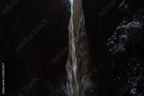 Obraz na płótnie View inside the narrow Karadakh Gorge with towering rock walls and a thin strip